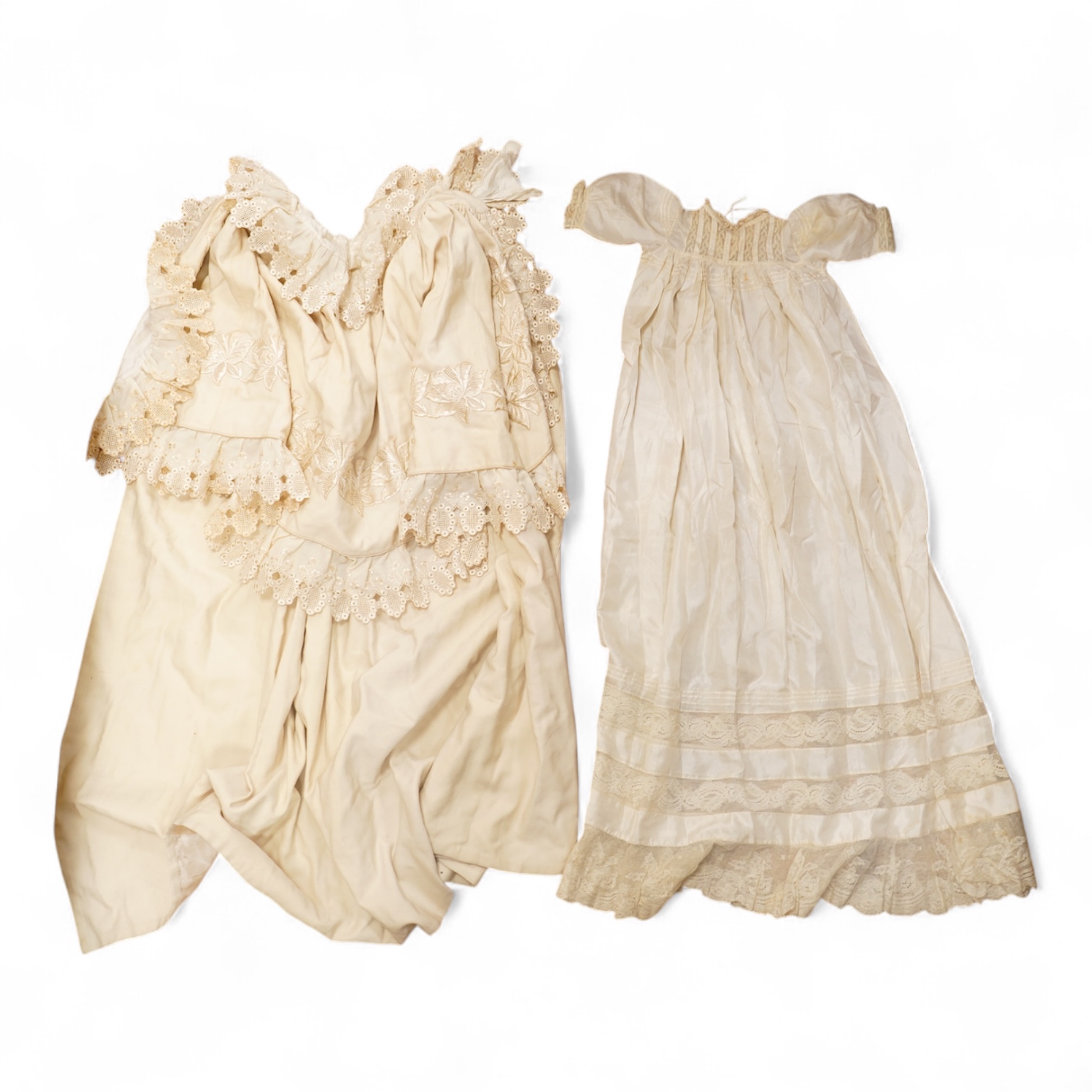 A 19th century cream wool lace and embroidered christening cape and silk baby gown, cape 102cm long. Condition - some stains